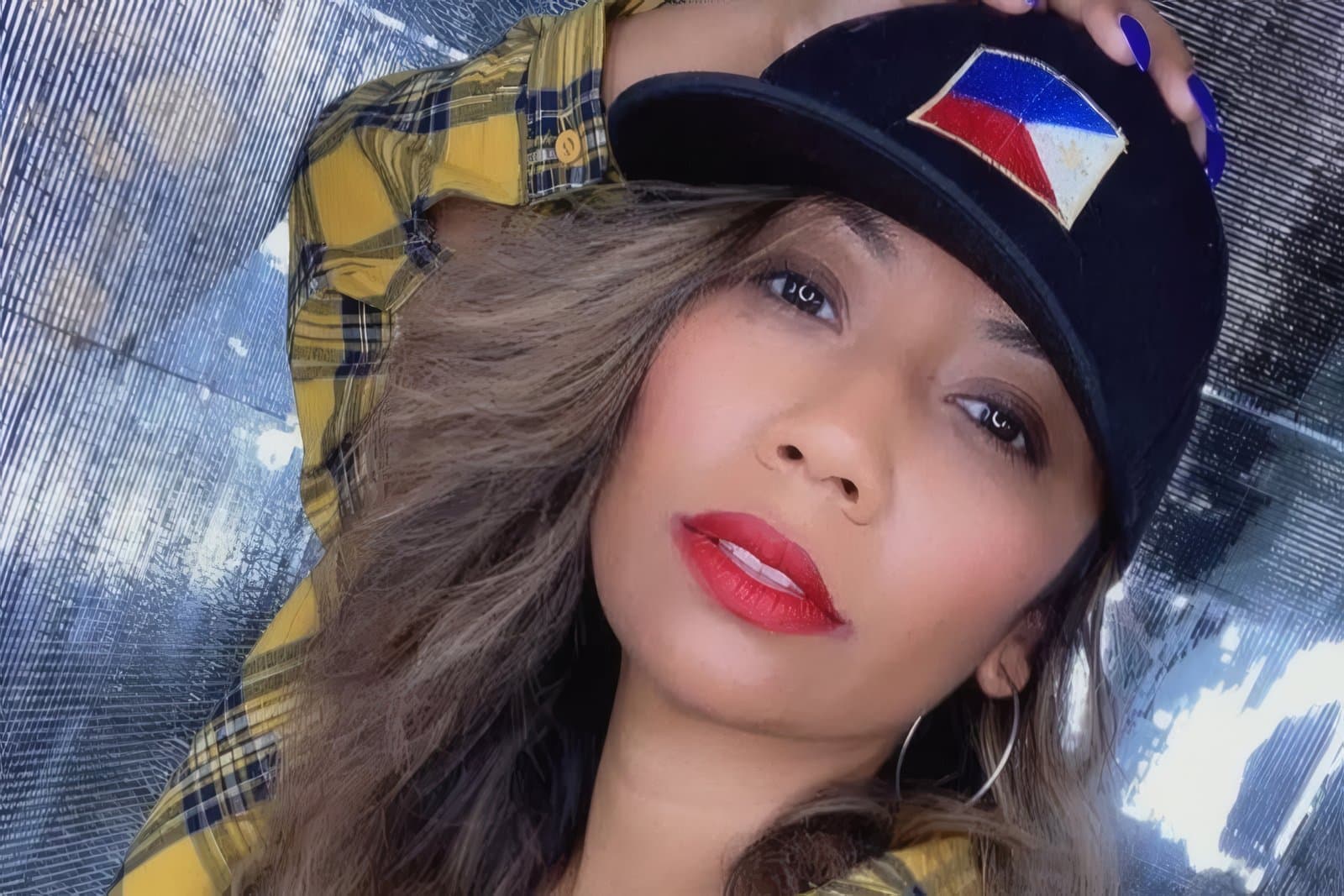 Sheryll Wade comedian headshot selfie in hat